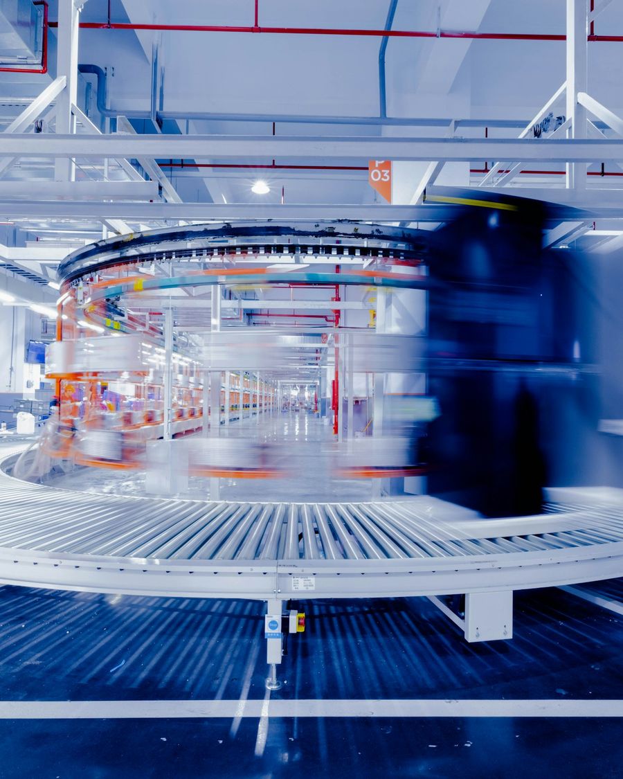 A conveyor, moving